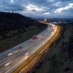 Cars driving on the M62 at night near Leeds