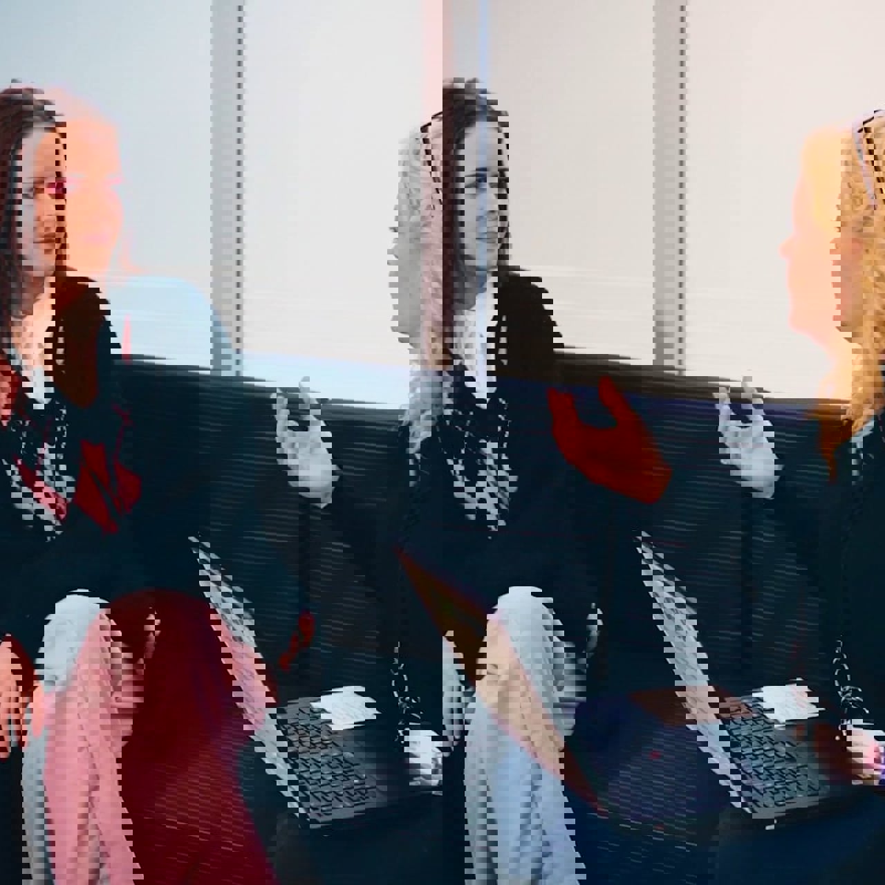 A young woman talking to a careers support adviser