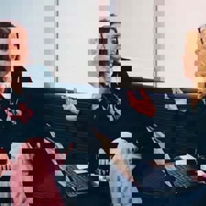 A young woman talking to a careers support adviser