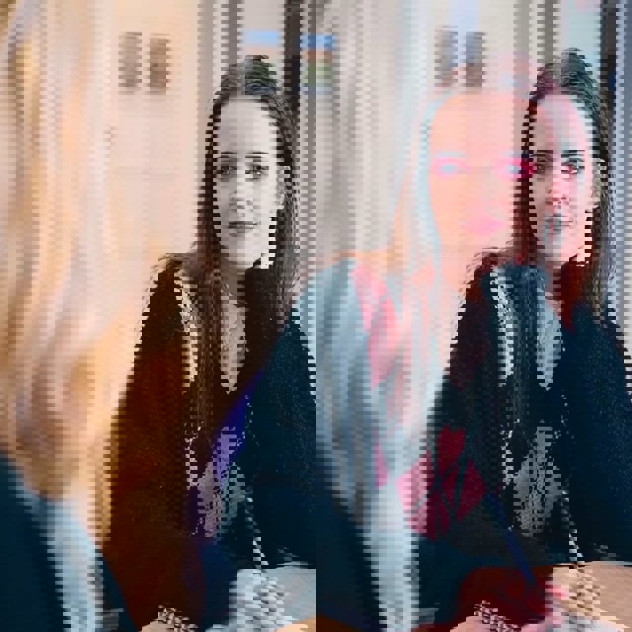 A young woman speaking to an Employment support adviser for career advice