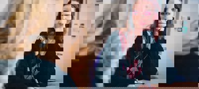 A young woman speaking to an Employment support adviser for career advice