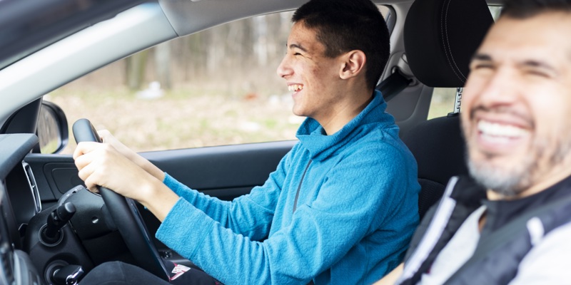 Son and parent driving