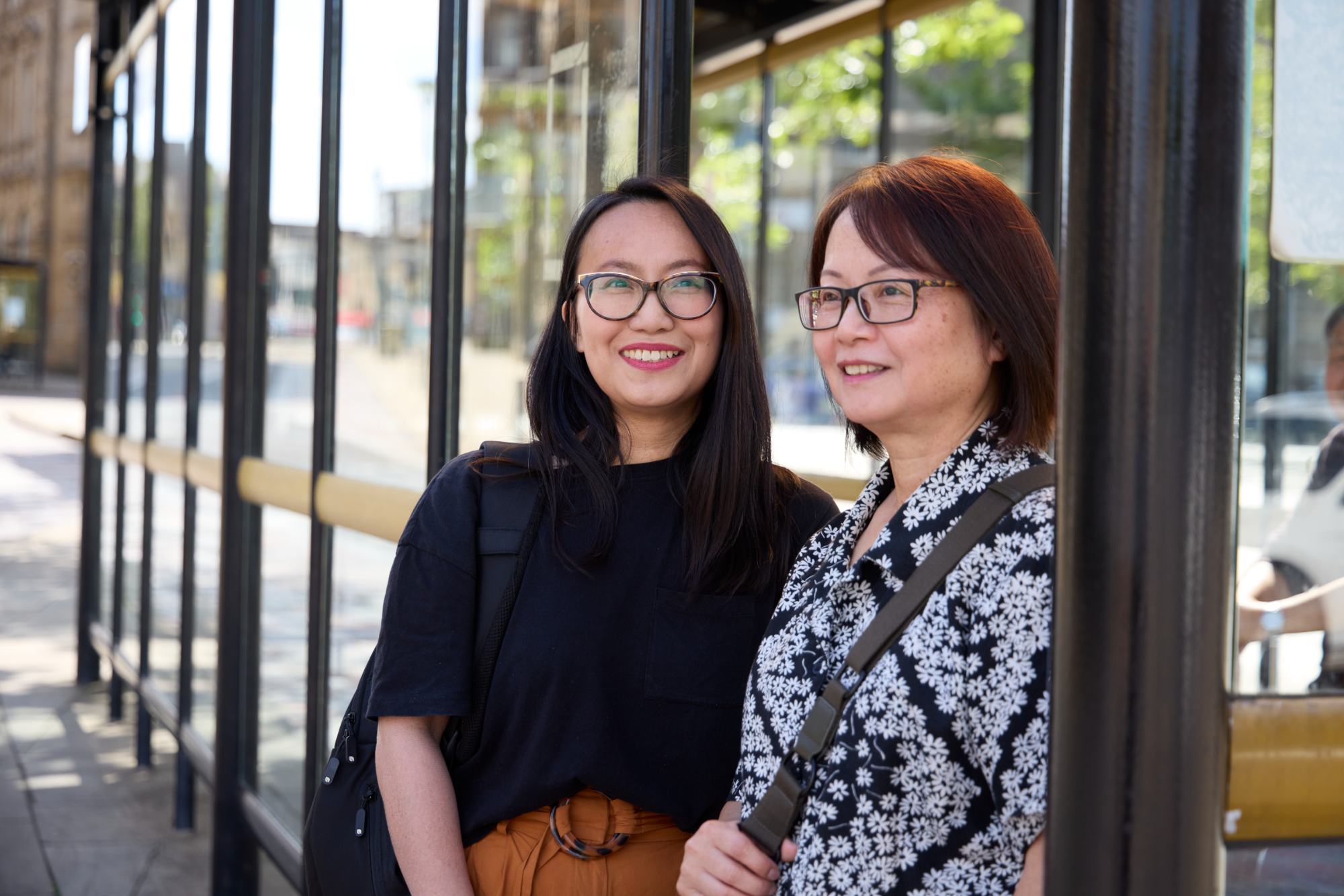 Two Women At Bus Stop