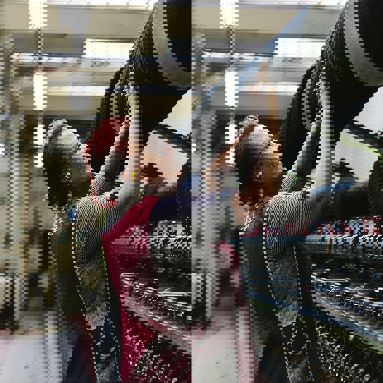 A woman weaving fabric on a machine