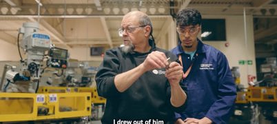 Simon training a student at college in a workshop
