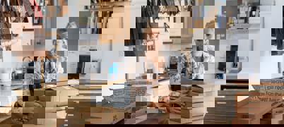 Small Business Owner holding cardboard boxes