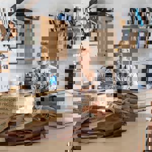 Small Business Owner holding cardboard boxes