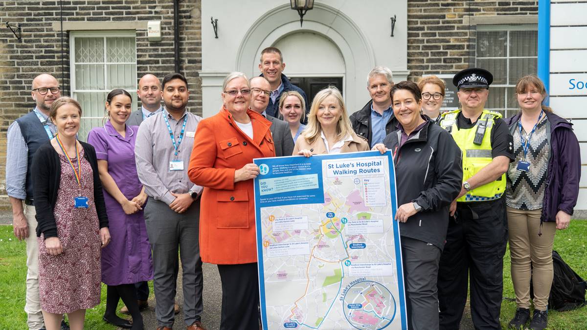 Mayor and others hold an A0 sized walking map