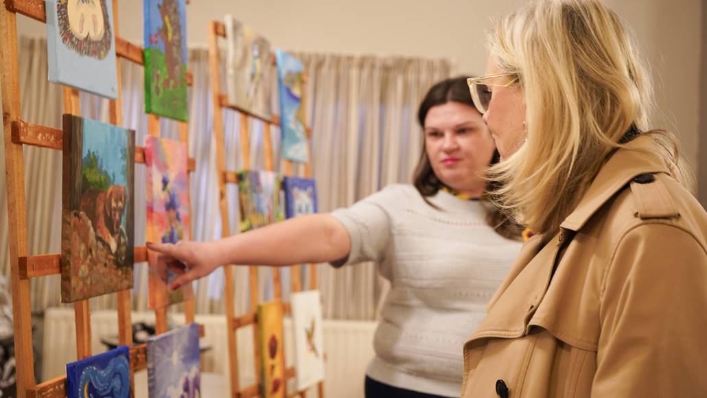 Mayor looking at artwork at Leeds Ukrainian center