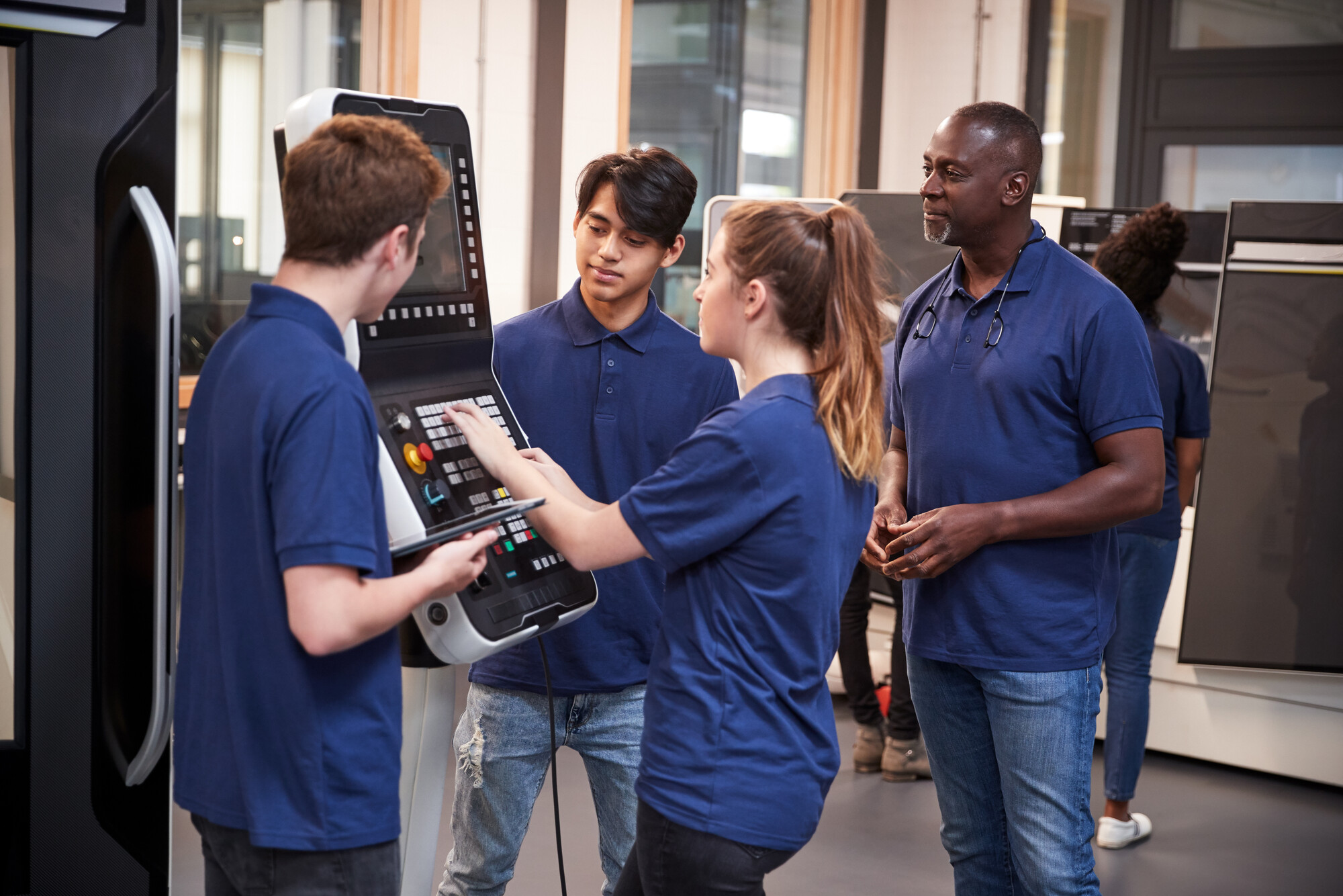 Young people working together in a technology room