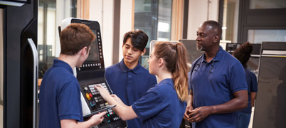 Young people working together in a technology room