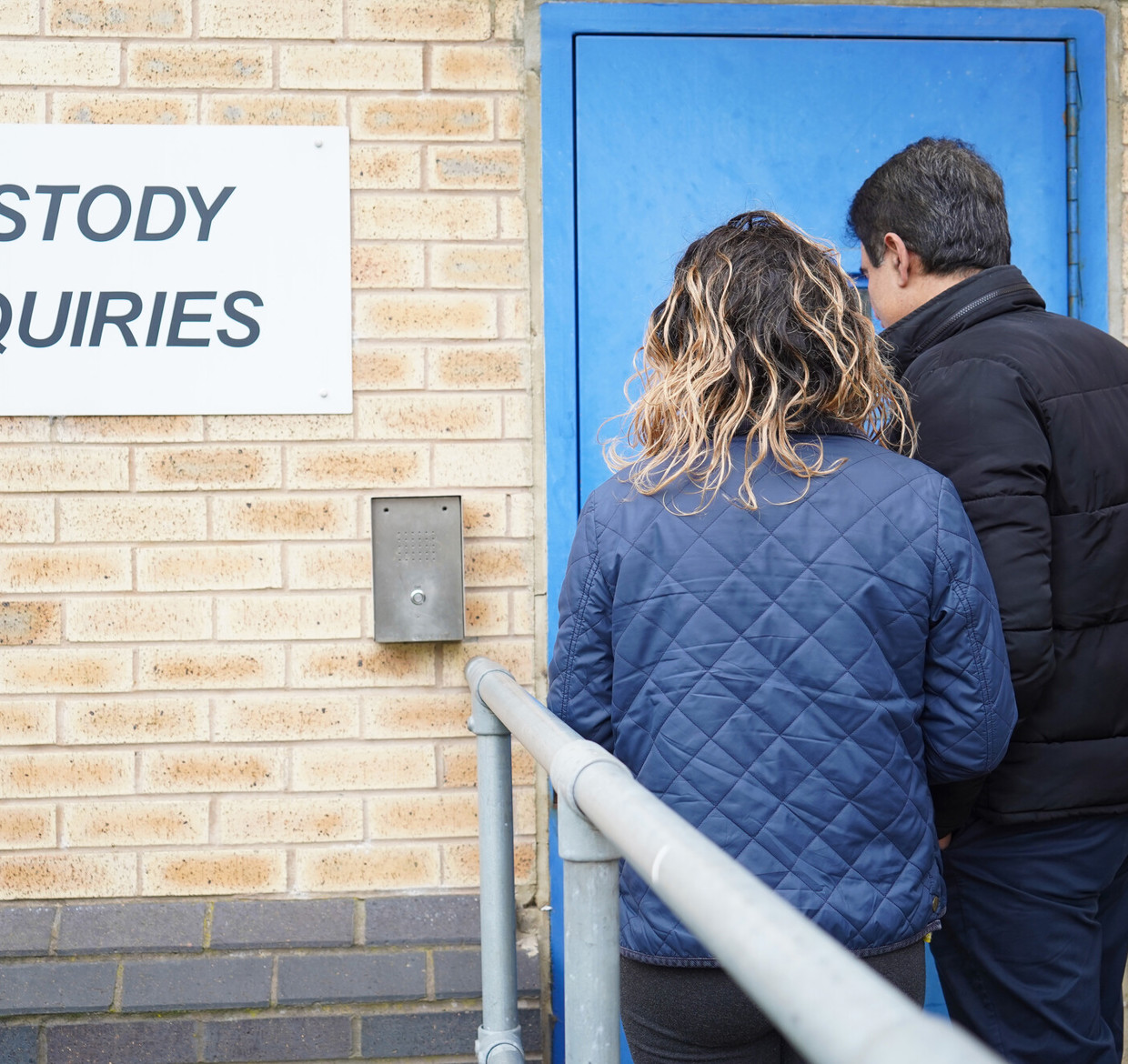 Two Independent Custody Visitors going into the custody suite