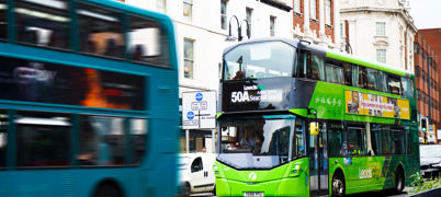 A green coloured bus in Leeds