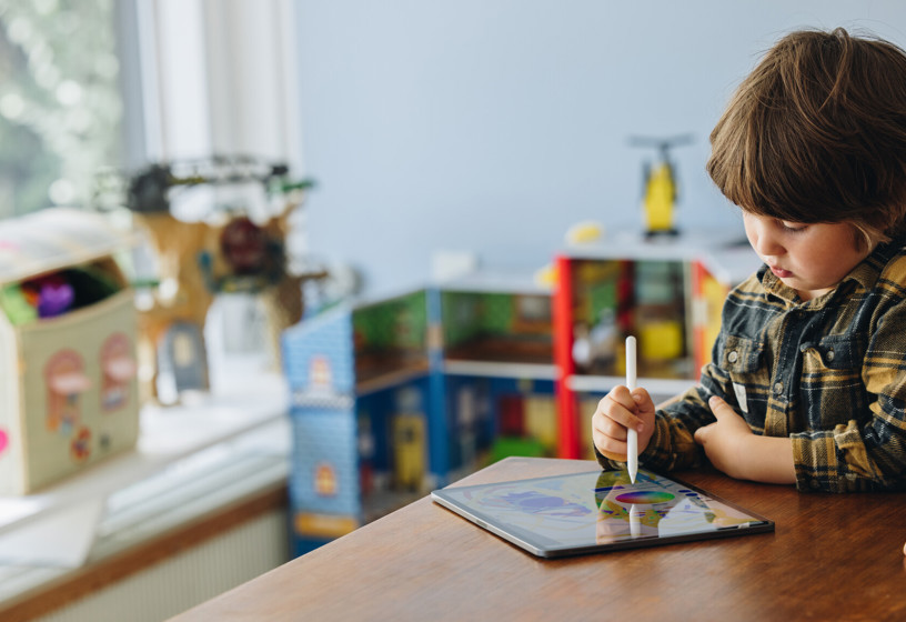 Child playing on iPad 