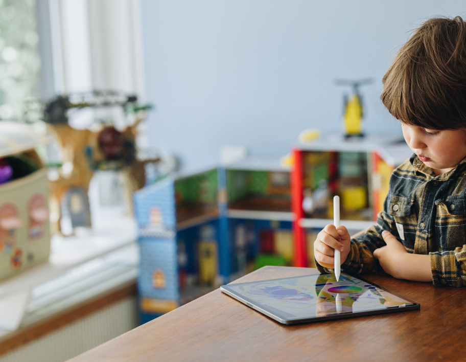 Child playing on iPad 