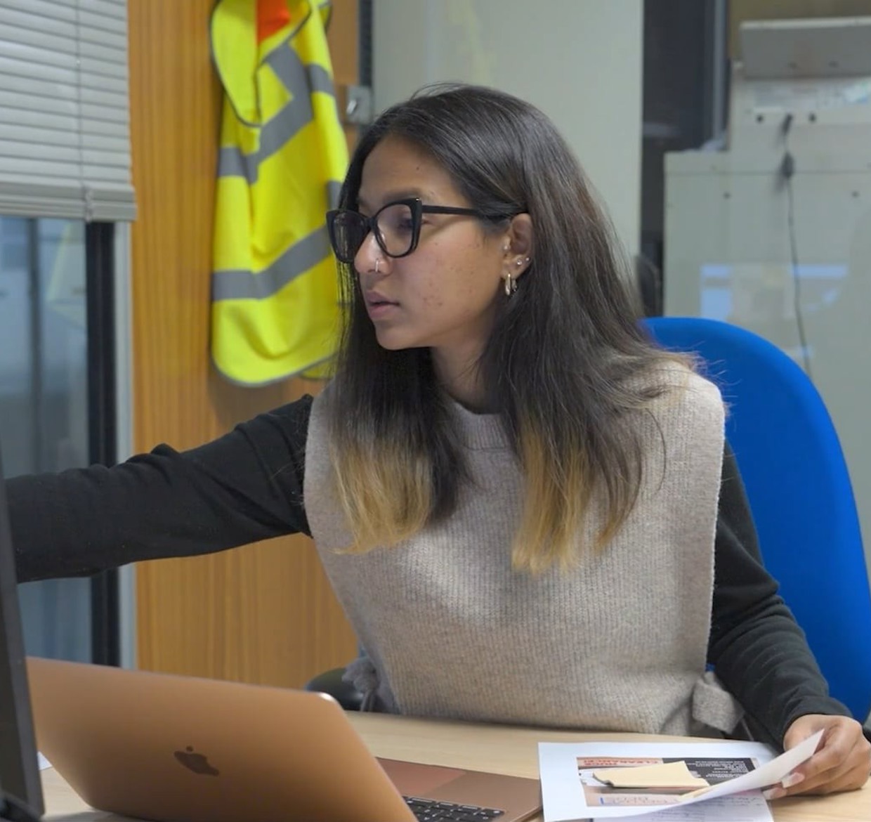 Woman working on a computer at a desk