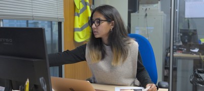 Woman working on a computer at a desk