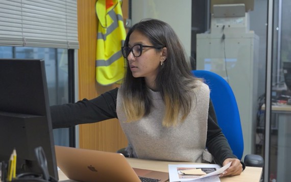 Woman working on a computer at a desk