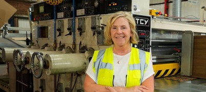 Woman in standing in manufacturing factory