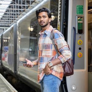 Man Stepping Off A Train