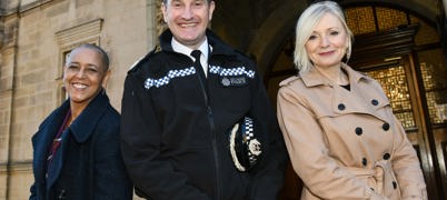 Deputy Mayor Alison Lowe, chief constable John Robins and Mayor Tracy Brabin stood next to each other outside the doorway of a building