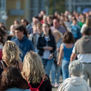 People walking in a busy street scene