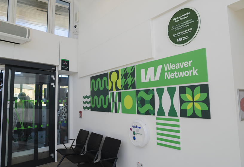 Heckmondwike Weaver Network green plaque and artwork inside the bus station