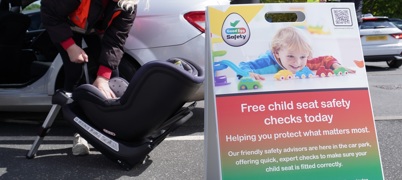 Car seat check with sign