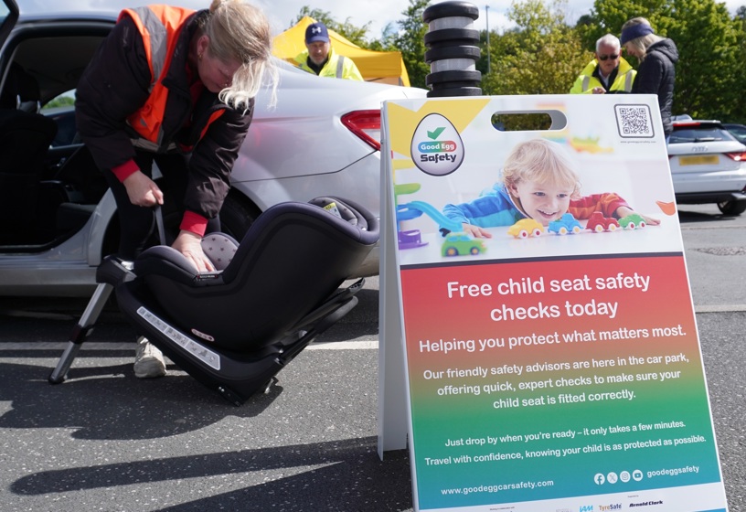 Car seat check with sign