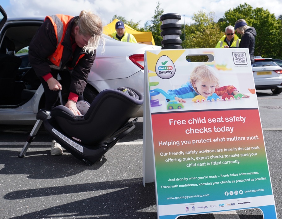 Car seat check with sign