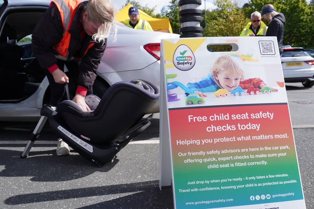 Car seat check with sign