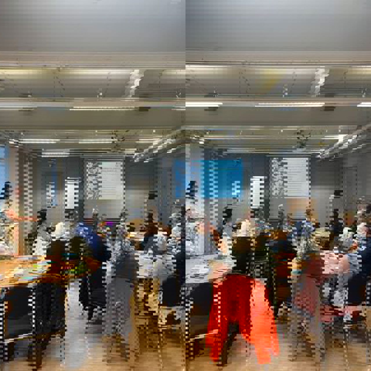 A presentation being delivered at a community leaders meeting