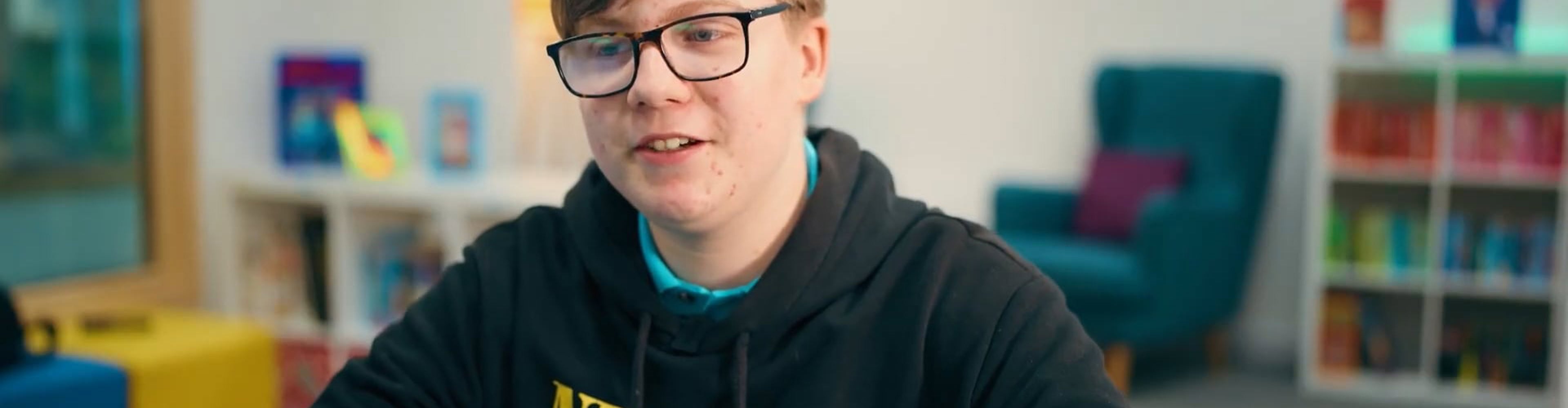 Tyler sat at a desk