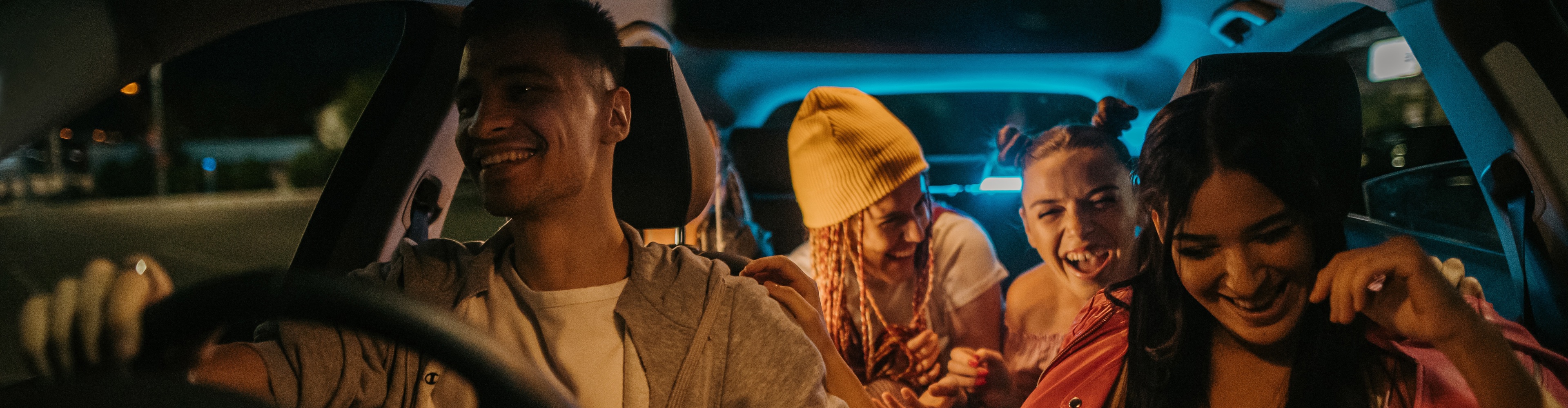 Young people driving in a car