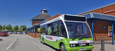 Access Bus parked outside supermarket