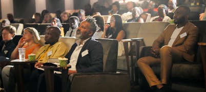 Filmmaker Luke Alwyn sat with entrepreneurs at the Everyman in Leeds, facing the screen