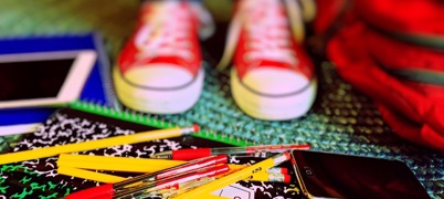 An image of shoes and coloured pens