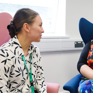 Two colleagues speaking to each other