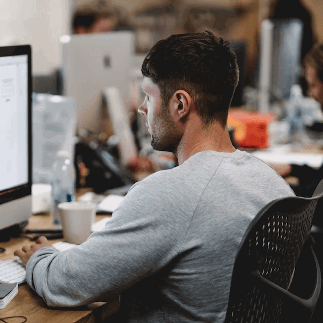 apprentice working at computer