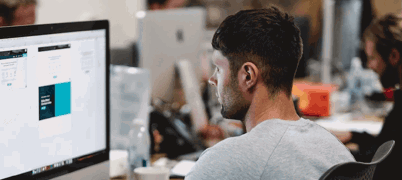 apprentice working at computer