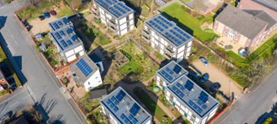 Aerial view of houses with solar panels