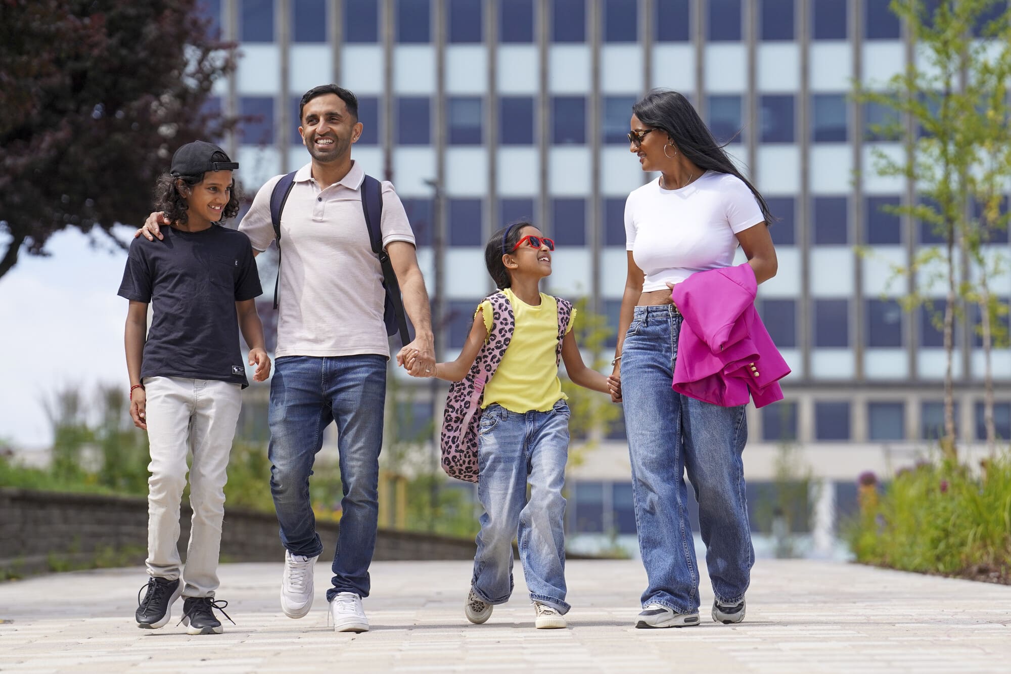 A family holding hands in Bradford
