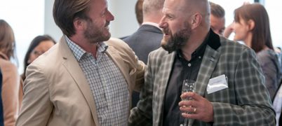 Two people talking at an event