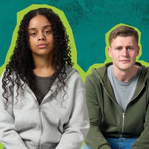 Two young adults sitting down