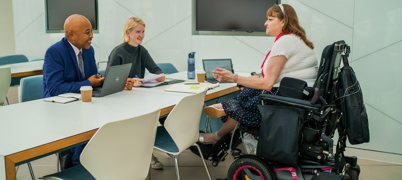 Woman in wheelchair attending an interview