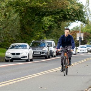 A cyclist in a cycle lane in Leeds