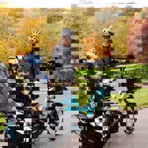 Woman and child with bike in park