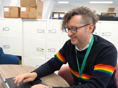 Jonathan, Enterprise Coordinator at the Combined Authority, working at laptop 