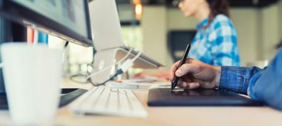 Computer and keyboard on a desk