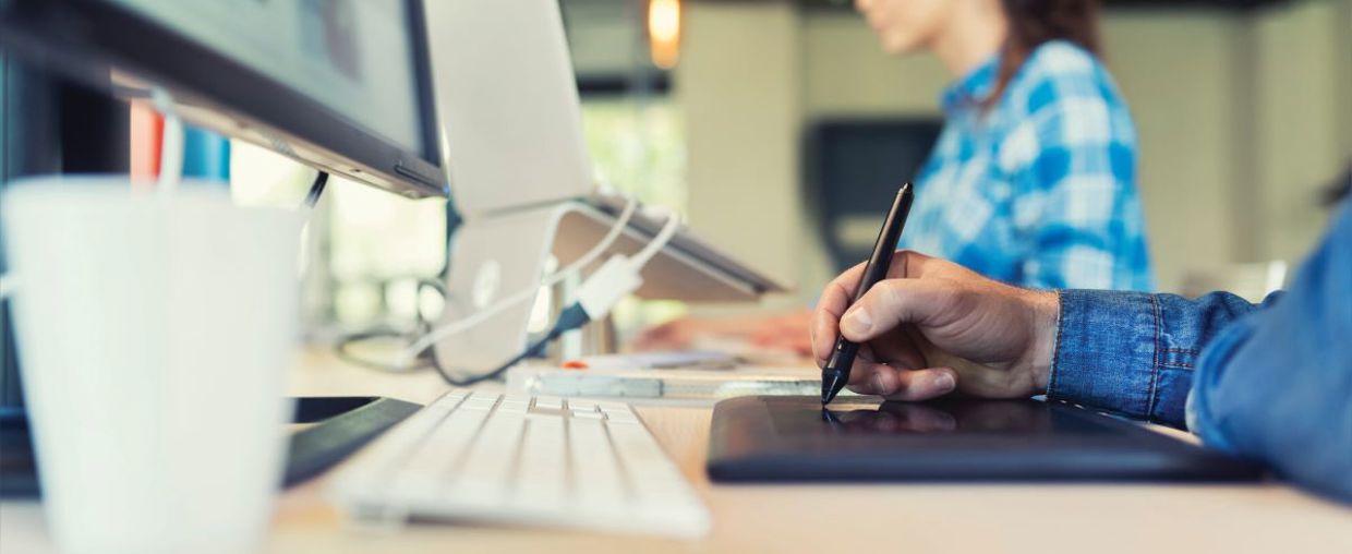 Computer and keyboard on a desk